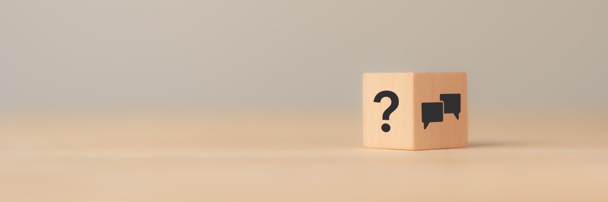 Q and A concept. Q and A symbols on wooden cube block on a grey