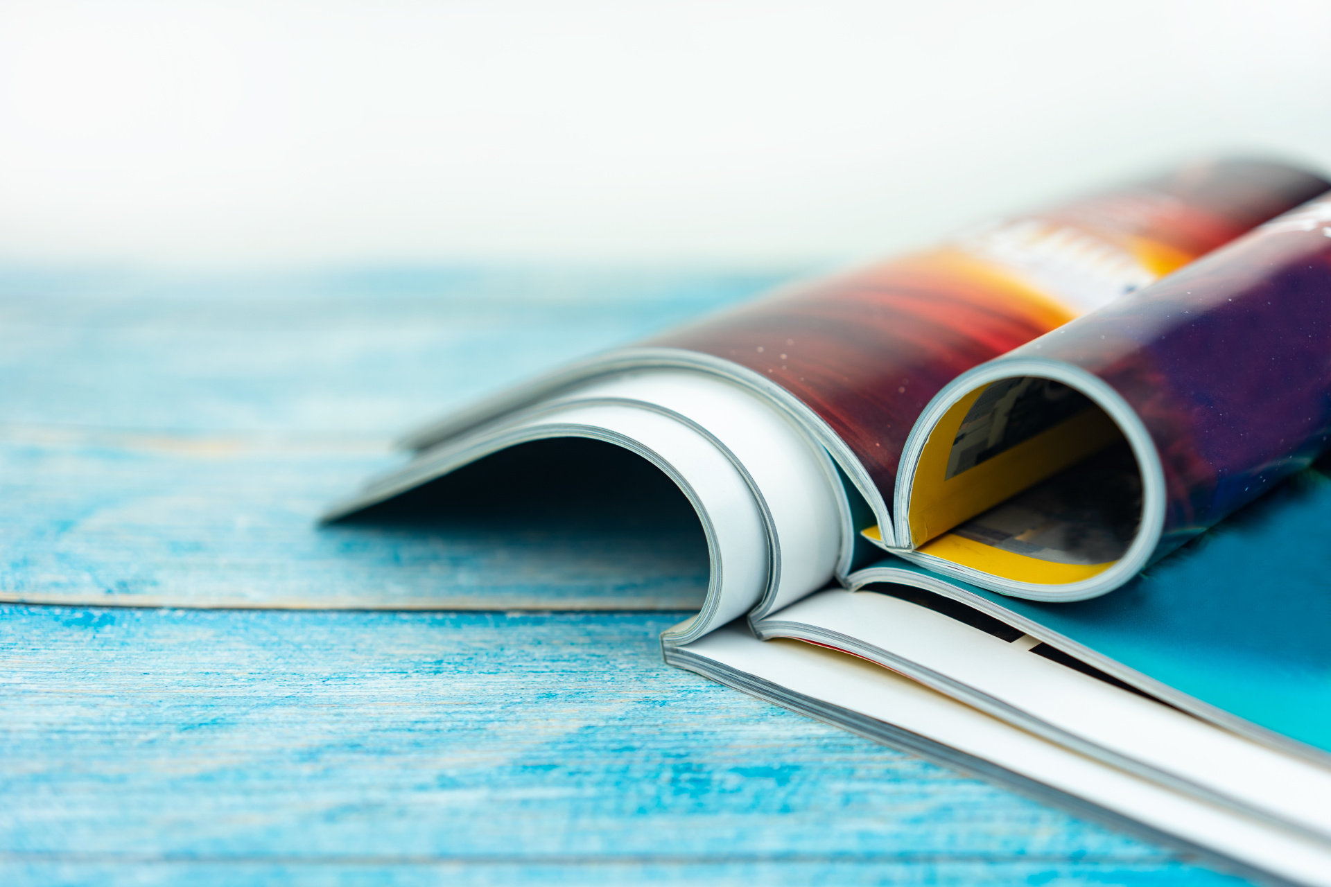 Stack magazines on wooden table