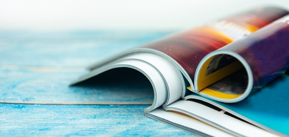 Stack magazines on wooden table